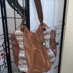 The Sak bohemian leather bag medium to large in size with braided straps.